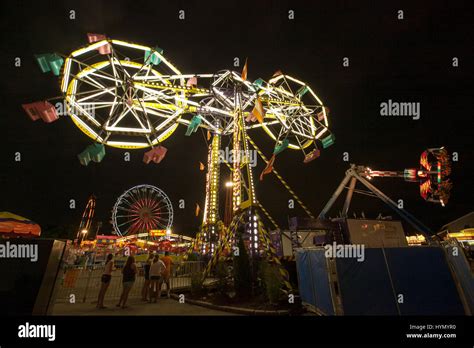 People enjoy Iowa State Fair carnival rides at night Stock Photo - Alamy