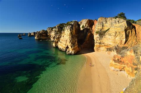 Pristine Beaches and Dramatic Shoreline in Lagos, Portugal - Places To ...