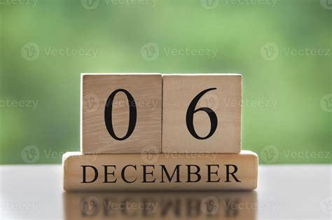 December 6 text on wooden blocks with blurred nature background ...