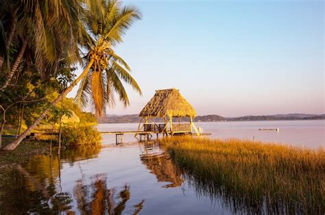 Premium Photo | Sunset scene at the lake peten itza, guatemala. central america.