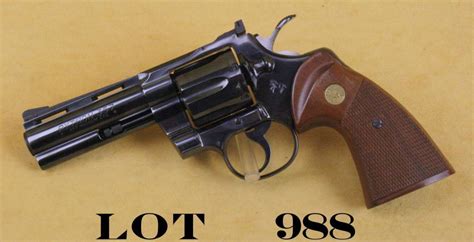 Colt Python DA revolver, .357 magnum cal., 4” barrel, blue finish, checkered wood medallion combat