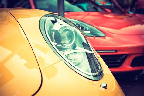 Premium Photo | Close up of a yellow sport car: headlights