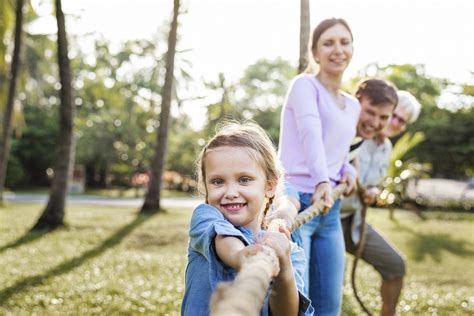 Family playing tug of war | Premium Photo - rawpixel