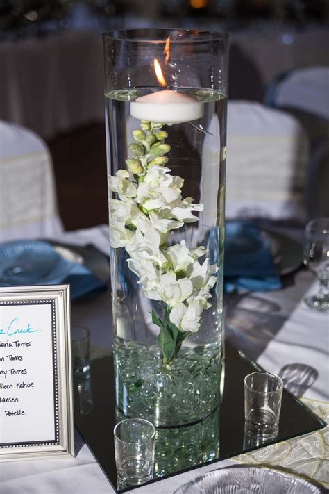 Submerged Flower Centerpiece with Floating Candle | Floating candle ...