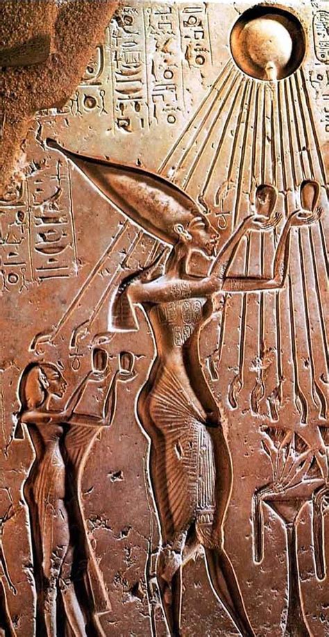 King Akhenaten and his wife Nefertiti praying to the sun-god Aten who provided his rays to the ...