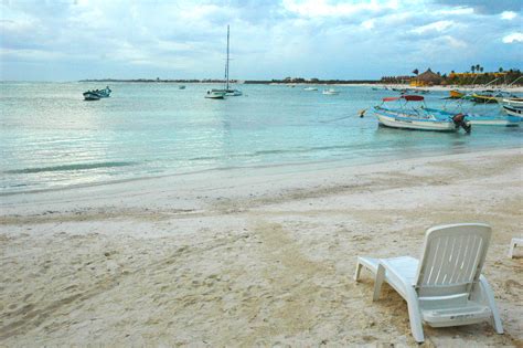 Beach Chair And Boats Free Stock Photo - Public Domain Pictures