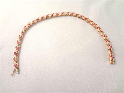 Lot Detail - 14K Gold Tennis Ruby Bracelet (60) Round Rubies 2.0mm (1.8 carat)