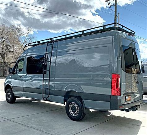 Aluminess roof rack and ladder on this gorgeous Sprinter van!