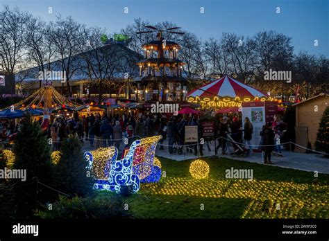 Seattle Christmas Market scene with the Christmas Pyramid, Santa s sleigh, holiday lights, and ...