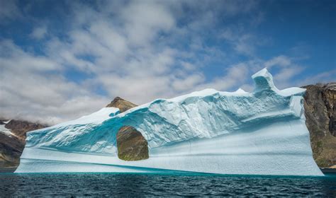 A massive iceberg in Greenland. [2048x1211][OC] : r/EarthPorn