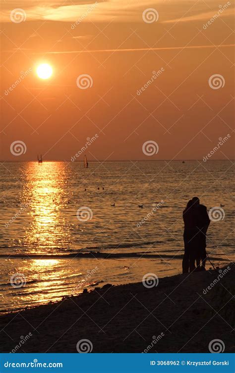 Sunsetting on beach stock photo. Image of cloud, rest - 3068962