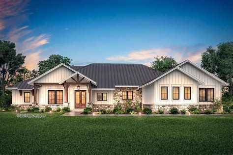 This one-level, hill country home plan proudly delivers a grand curb appeal with a st… | Ranch ...