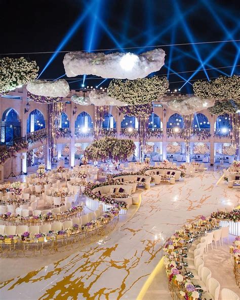 Between the unique table shapes and suspended floral installations, this #Dubai wedding by @ibe ...