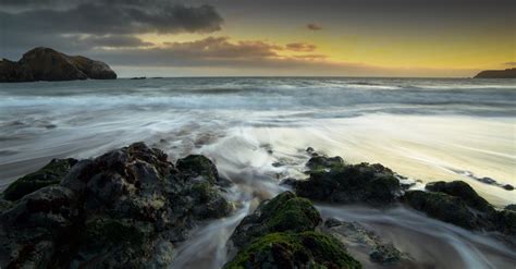 Rocks on Seashore during Golden Hour · Free Stock Photo