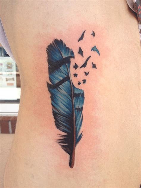 Feather into Birds Tattoo Meaning | 40 Mind Blowing Feather Tattoos | Feather tattoos, Blue jay ...
