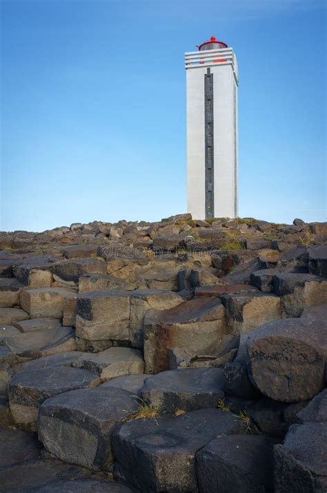 Vertical Shot of Kalfshamarsvik Lighthouse with Basalt Formed Sea Cliffs, Iceland Stock Photo ...