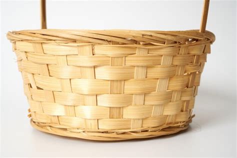 Premium Photo | Brown straw basket on a white surface