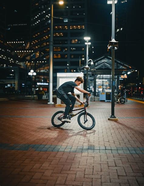 Woman and Man Standing Beside Bicycle · Free Stock Photo