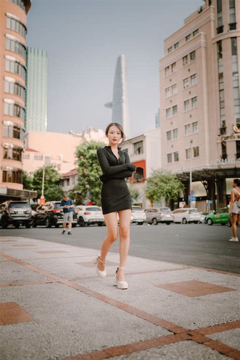 Woman in Black Clothes Walking on Sidewalk · Free Stock Photo