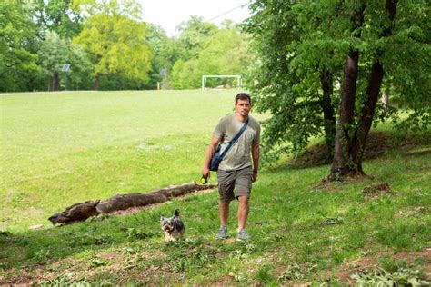 Man with Dog Enjoying in Funny Walking Stock Photo - Image of ...