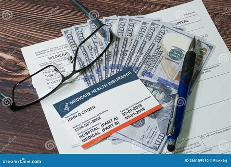 Medicare Card, Application Form and Cash with Eyeglasses and Pen. Stock ...