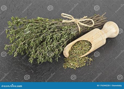 Dried Thyme and Bundle of Thyme Sprigs on Black Background Stock Photo ...