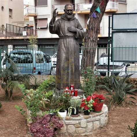 Bronze Statue Of St Padre Pio Stands In The Garden