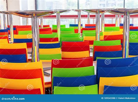 Multi-colored Plastic Chairs and Tables in a Closed Cafe Stock Photo - Image of bistro ...