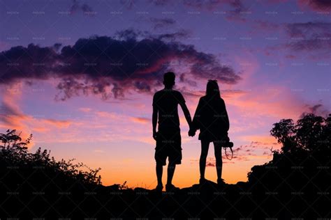 Couple Holding Hands At Sunset - Stock Photos | Motion Array