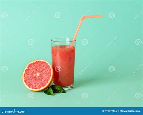 Glass of Freshly Squeezed Grapefruit Juice with Pulp, Drinking Straw ...