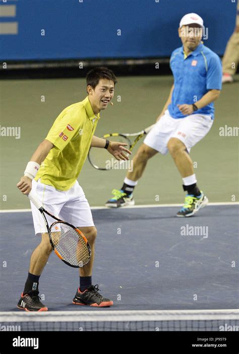 Japanese tennis star Kei Nishikori (L) and his coach Michael Chang play ...