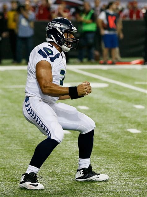 Russell Wilson #3 of the Seattle Seahawks celebrates a fourth quarter ...