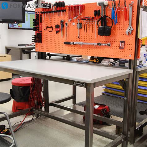 Manufacturing Workbenches with Orange Pegboards | Formaspace