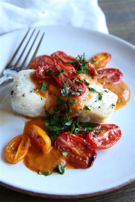 Roasted Cod with Tomato Cream Sauce Recipe - Delish.com