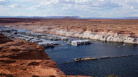 Lake Powell water levels hit record lows, forcing off some houseboats