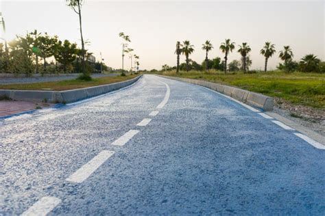 Winding Tarred Road through Autumn Trees Stock Photo - Image of line ...