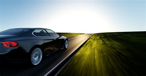 Car Driving On A Sunset Road Stock Photo - Download Image Now - iStock