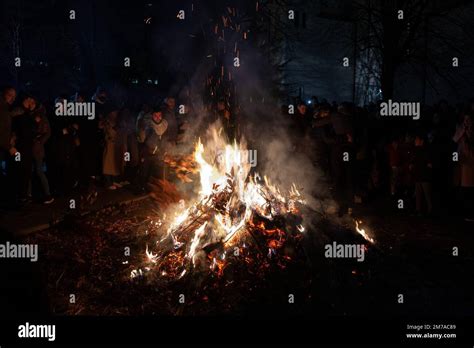 People burning Badnjak on Orthodox christmas night in belgrade, Serbia. The badnjak also called ...