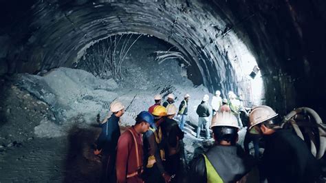 Rescuers dig to reach 40 workers trapped in collapsed road tunnel in north India | Euronews