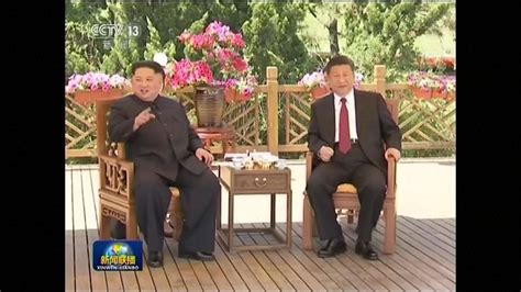 Kim Jong Un strolls along seaside with President Xi Jinping in China ...