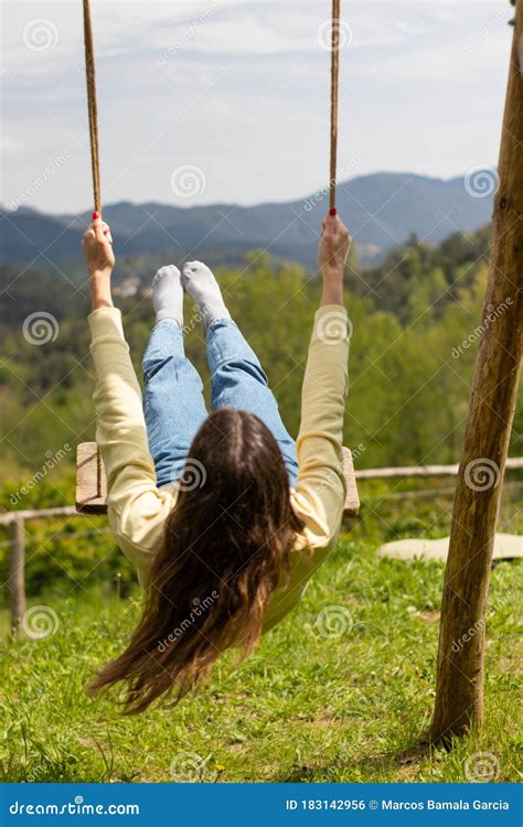 Young Brunette Woman Swinging Barefoot in a Park Outside on a Sunny Day. Stock Photo - Image of ...