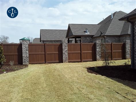 Brown Vinyl Fence with Brick Columns | Brick columns, Vinyl fence, Brick fence