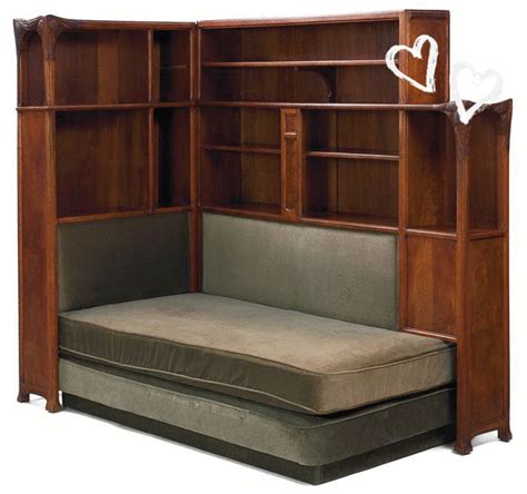 a wooden bookcase with a couch underneath it