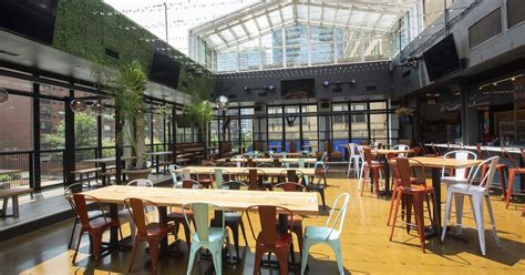 Inside Roots Pizza South Loop, Bringing a Retractable Roof to Printer’s ...