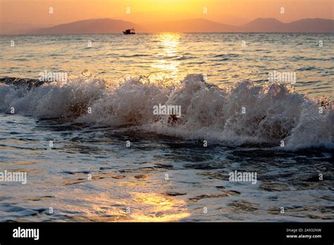 silhouette of fishing boat on front of sunset Stock Photo - Alamy