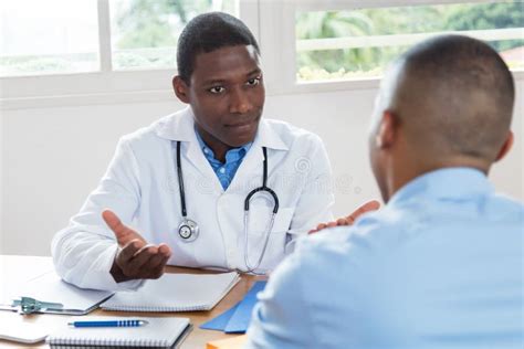 African American Doctor Explaining Diagnosis To Patient Stock Photo ...