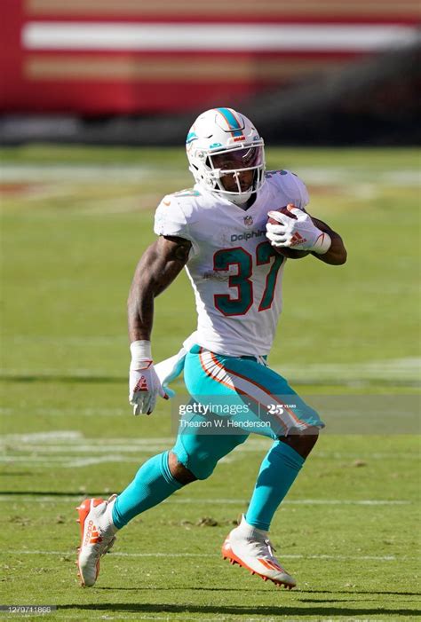 Myles Gaskin of the Miami Dolphins carries the ball against the San ...