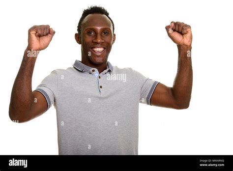 Young happy black African man smiling and looking excited Stock Photo ...