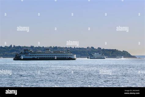 Walla Walla ferry passing the Suquamish ferry of Washington State Ferries in Puget sound Seattle ...