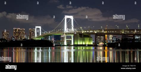 Tokyo Rainbow bridge and Tokyo Tower at sunset Stock Photo - Alamy